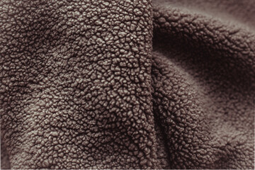 Color of the Year 2025 Mocha Mousse color. Chocolate or Brown Background. Close-Up of Brown Textured Wool Surface with Dense Abstract Patterns