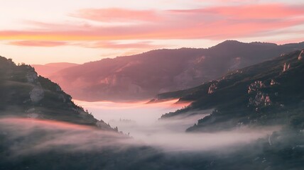 Fototapeta premium Misty Sunrise Over Mountain Peaks
