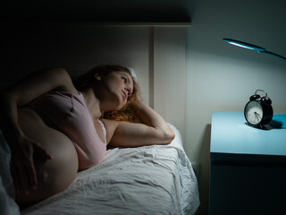 Pregnant woman suffers from insomnia. 