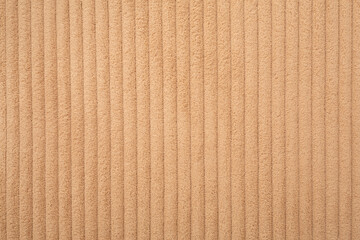 Beige knitted fabric as background, top view