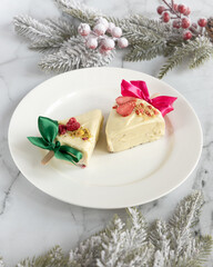 A Beautifully Crafted Festive Holiday Dessert Artfully Displayed on a Plate with a Decorative Bow