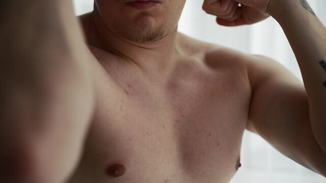 Male biceps on the arm.
Pumped up muscles of a man.
An athletic man shows off his muscles.
Strong guy with pumped up arms