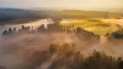 Fototapeta premium Chýnov Bridge at sunrise in the morning fog. Granite viaduct built in the village of Chýnov in South Bohemia