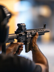 Shooting practice at indoor range with a rifle