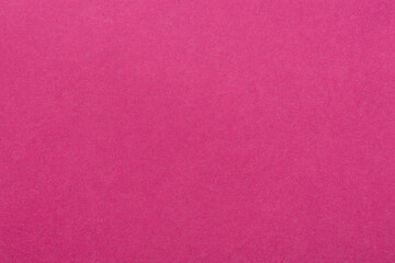 Pink paper sheet fabric texture. Pink canvas cardboard texture as a background. Pink magenta paperboard photographic background