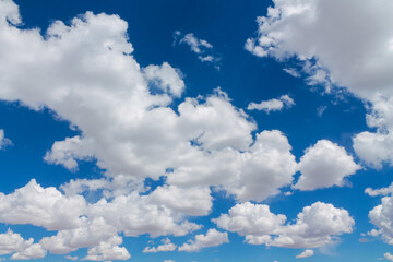 Blue sky with clouds cloudscape. High deep blue sky with fluffy clouds