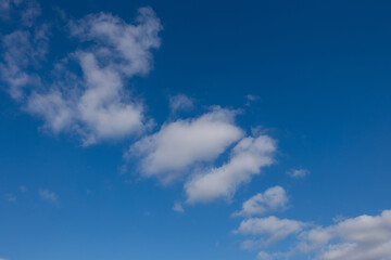 Blue sky with few clouds.