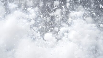 Abstract winter background featuring a blizzard. White snow drifts and snowflakes fill the frame, creating a dreamy, cold atmosphere. Perfect for winter-themed designs.