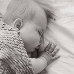 black and white portrait of a sleeping boy close up, baby sleeps