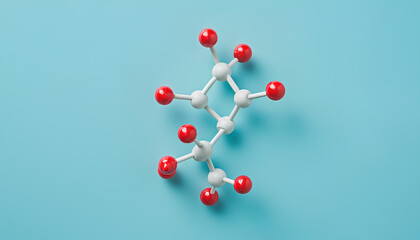 Molecule of phenylalanine on light blue background, top view. Chemical model