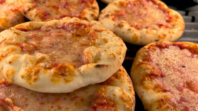 Tracking shot on small pizzas