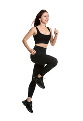 Woman in sportswear exercising on white background