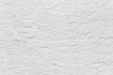 Texture of white plaster on a concrete wall handmade. Construction, interior design.