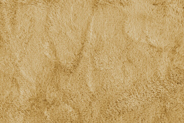 Soft shaggy yellow carpet texture. Fluffy synthetic textile fur, plush textile, blanket cloth...