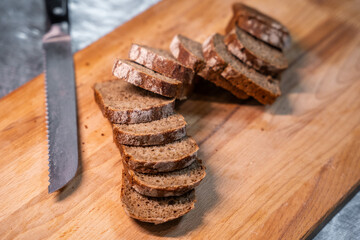 Sliced bread on a wooden cutting board