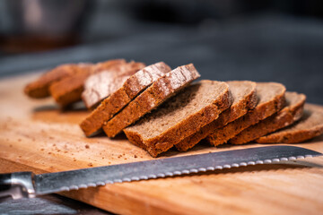 Sliced bread on a wooden cutting board