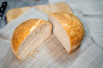 Round homemade delicious bread cut in half