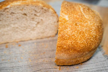 Round homemade delicious bread cut in half