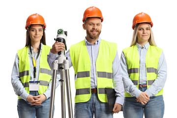 Team of geodetic surveyors posing with a measuring equipment
