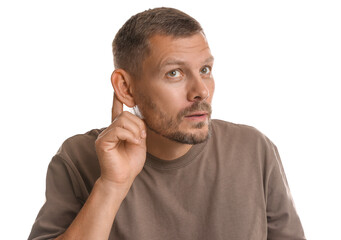 Man showing hand to ear gesture on white background