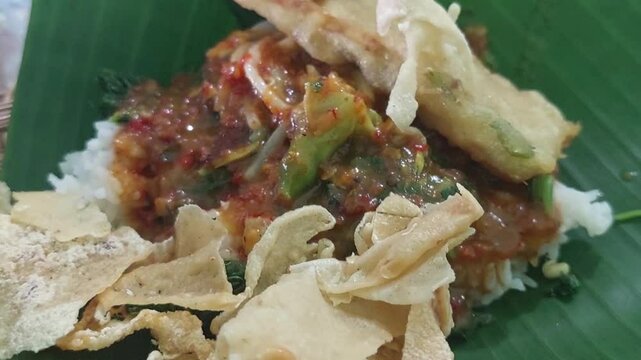 Pecel is a traditional Javanese food consisting of boiled vegetables drizzled with peanut sauce. Pecel is usually eaten with white rice, lontong, or ketupat.