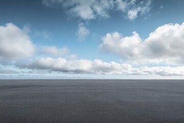 Empty asphalt road under a partly cloudy sky. (3)