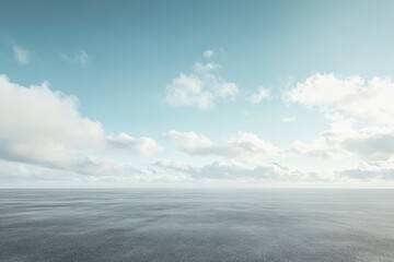 Calm, hazy sky over flat, textured ground.