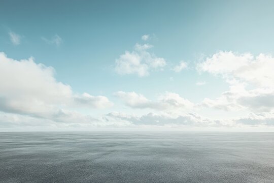 Calm, hazy sky over flat, textured ground.