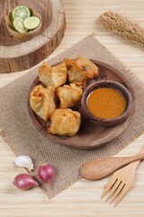 batagor,is a street food that is very popular in Indonesia.made from fish, tapioca and seasoning wrapped in dumplings then fried. Served with spicy peanut sauce. photographed with studio light