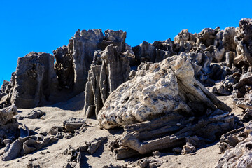A rocky hillside with a large rock in the middle