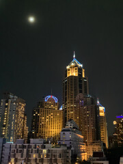 Skyline and the Moon at Night (Bangkok, Thailand) 
