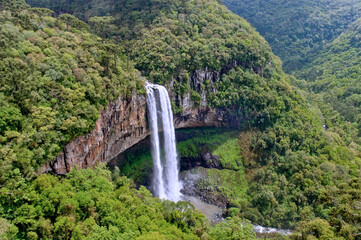 Caracol Falls, a 130 meters waterfall, formed by the Caracol River and cuts out of basalt cliffs in...