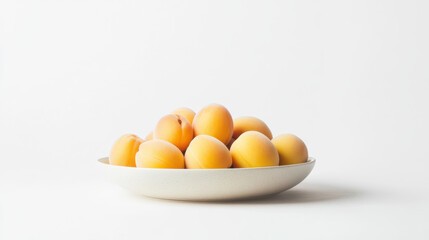 A neat bowl of golden apricots, soft yellow-orange tones accented with subtle hints of blush pink, elegantly presented on a pure white background. Hyperrealistic details of smooth fruit skin, minimali