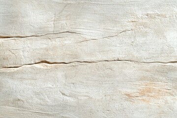 A white wall with a crack in it