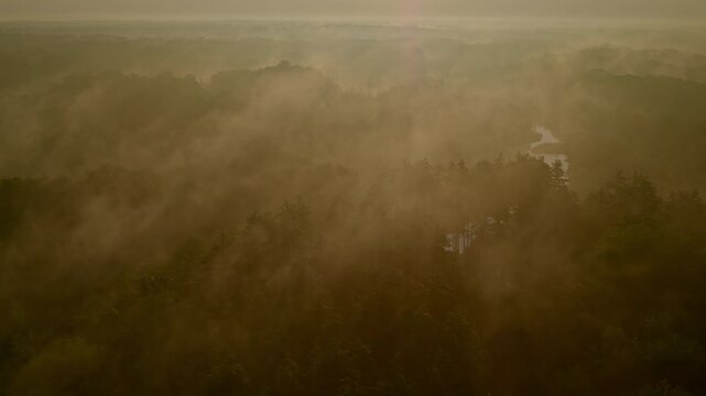 Milford, Michigan's Huron River, swathed in fog, seen from a drone&rsquo;s eye at sunrise.