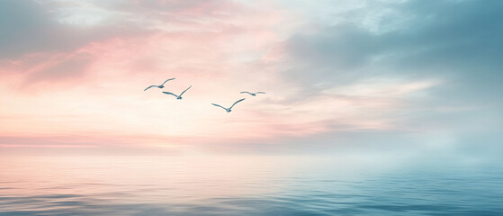 Obraz premium serene scene of flock of birds soaring above calm ocean at sunset