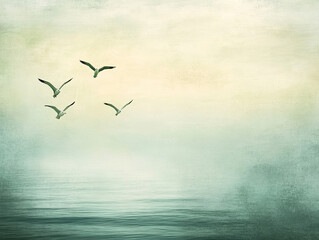 Fototapeta premium Serene image of birds flying over calm sea with soft colors and textures