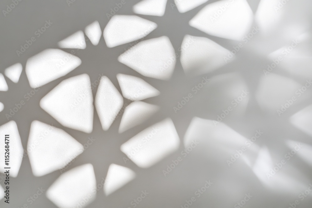 Poster Abstract shadow pattern creating star shapes on a light surface.