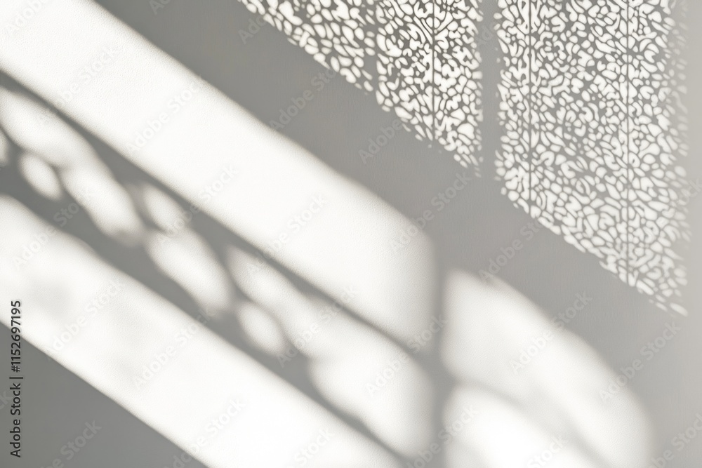 Poster intricate shadows cast on a wall, showcasing a decorative pattern.