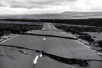 Cracked Road Through a Desolate Landscape