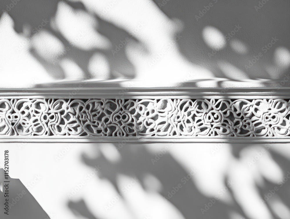 Poster a decorative white panel featuring intricate floral patterns and soft shadows.