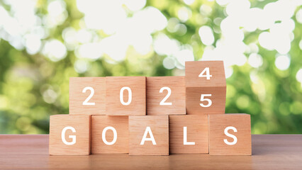 2025 goals concept. Wooden blocks changing from 2024 to 2025. Business growth, goals, planning, Happy New Year