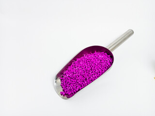 Purple masterbatch plastic granules, purple color polymer pigment granules cold cutting type isolated on white background, for product catalog design of plastic manufacturing industry company profile