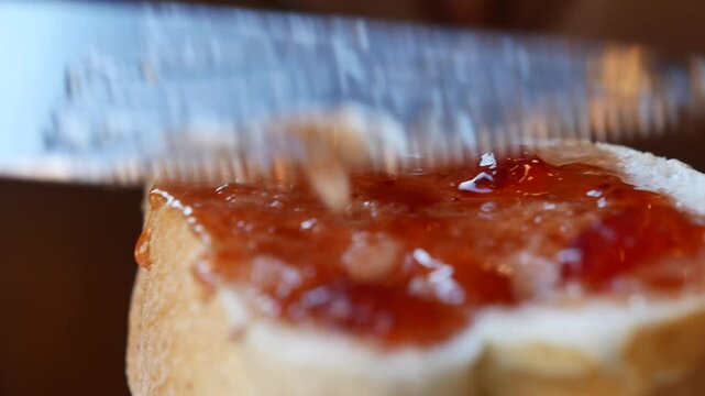 Spreading Jam on Fresh Toast at a Caf