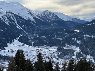 A fairytale winter atmosphere and a magnificent panorama on the mountine Swiss tourist resort of Klosters - Canton of Grisons, Switzerland (Kanton Graubünden, Schweiz)