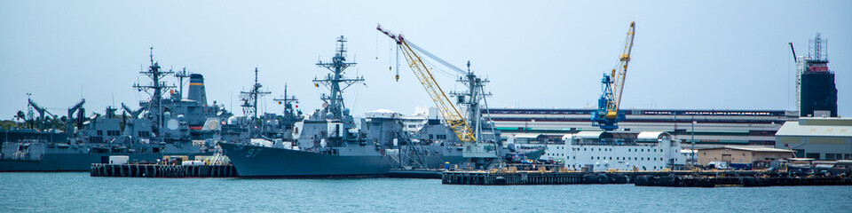 Fototapeta premium A large navy ship is docked at a pier