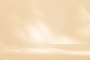 Wall interior background, studio and backdrops show products. with leaf shadow from window color beige and white. background for text insertion and presentation of product	
