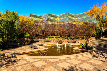 A large building with a fountain in front of it