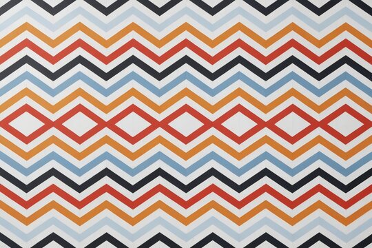 a close up of a colorful pattern of squares and lines