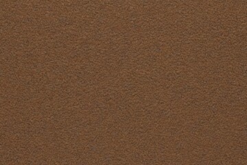 a close up of a brown leather surface with a small amount of dirt